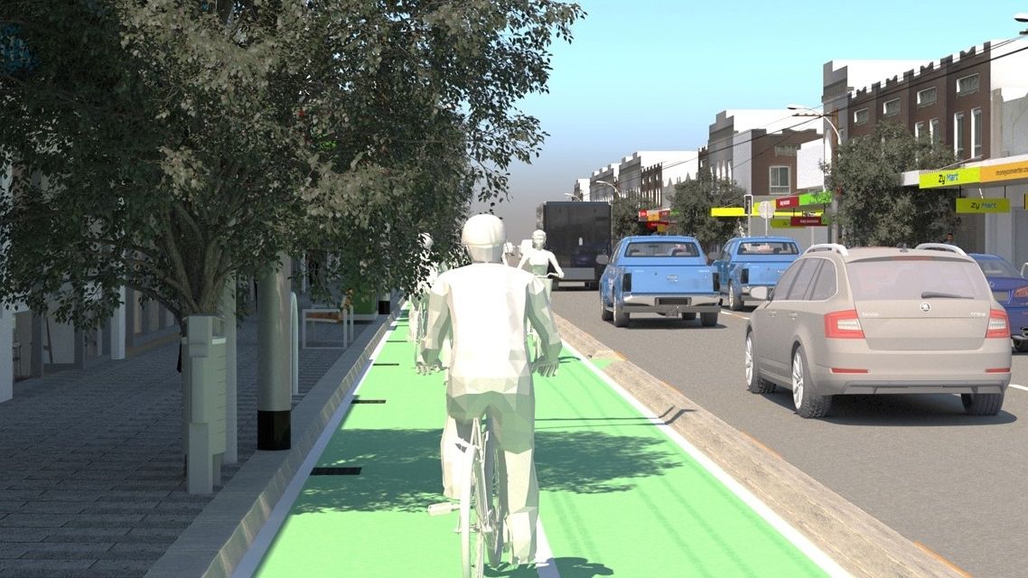 以虚拟现实模拟的形式呈现，一个动画人物在城市街道的自行车道上骑自行车，汽车驶过。