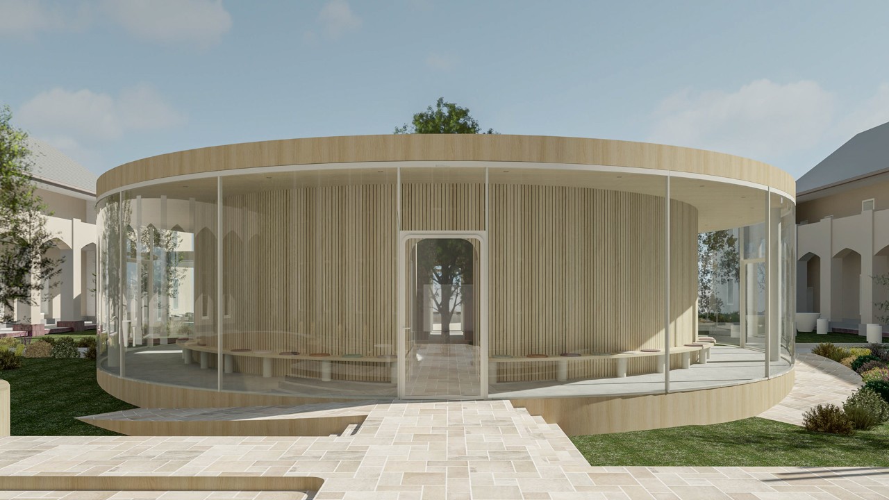 Redner介绍了一个由天然木材和玻璃制成的大型圆形户外凉亭，凉亭的中心生长着一棵树